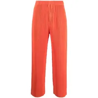 homme plissé issey miyake pantalon court mc august à design plissé - orange